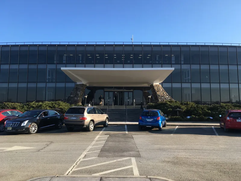 The curved glass facade and entrance canopy of IBM's Thomas J. Watson Research Center in Yorktown Heights, New York