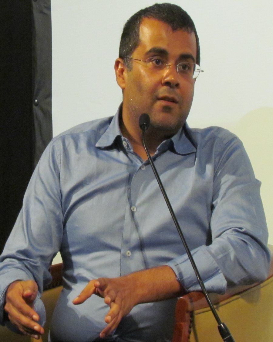 Chetan Bhagat speaking at the Sharjah International Book Fair in November 2011